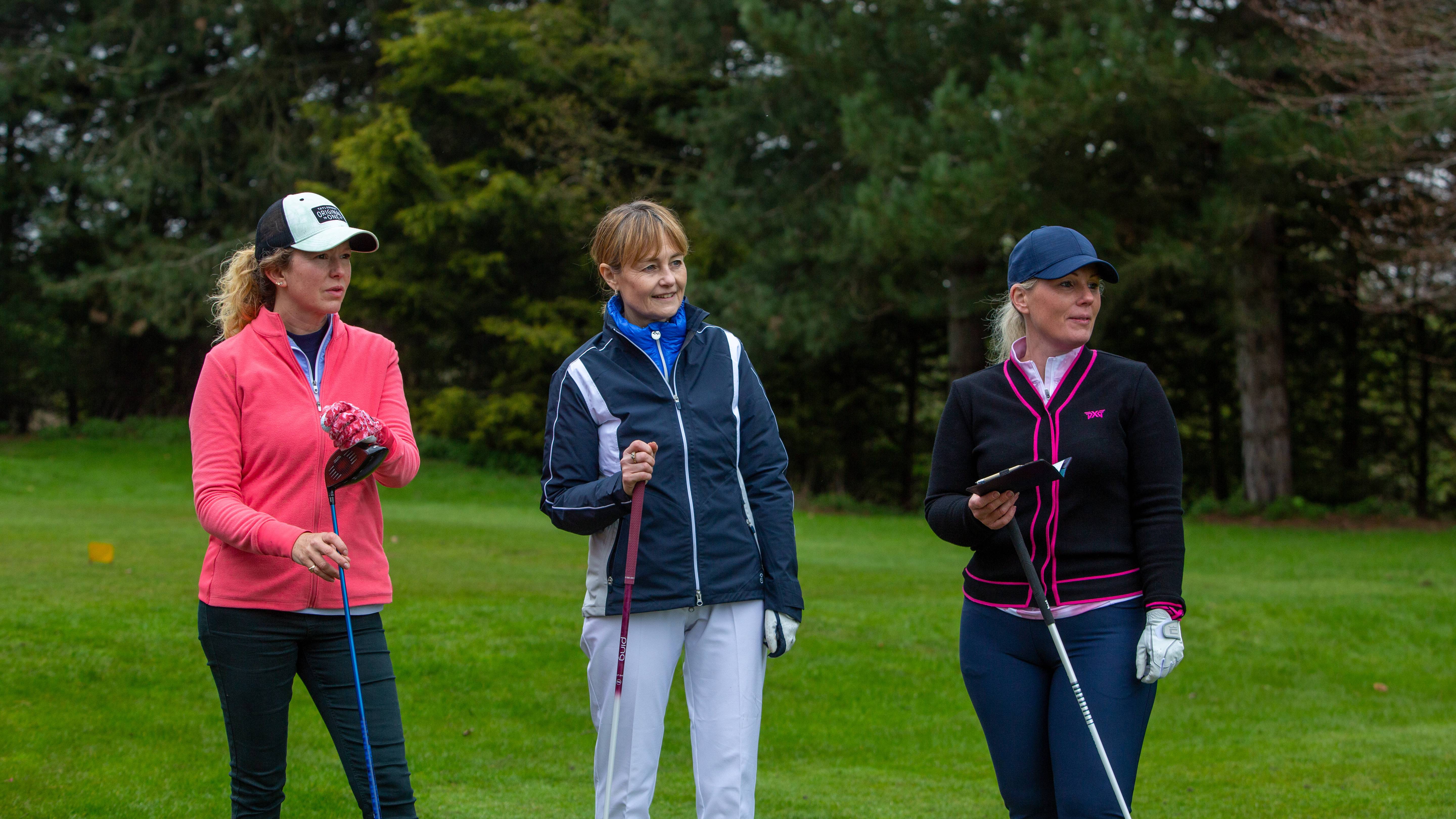 Group of friends enjoying a round of golf together